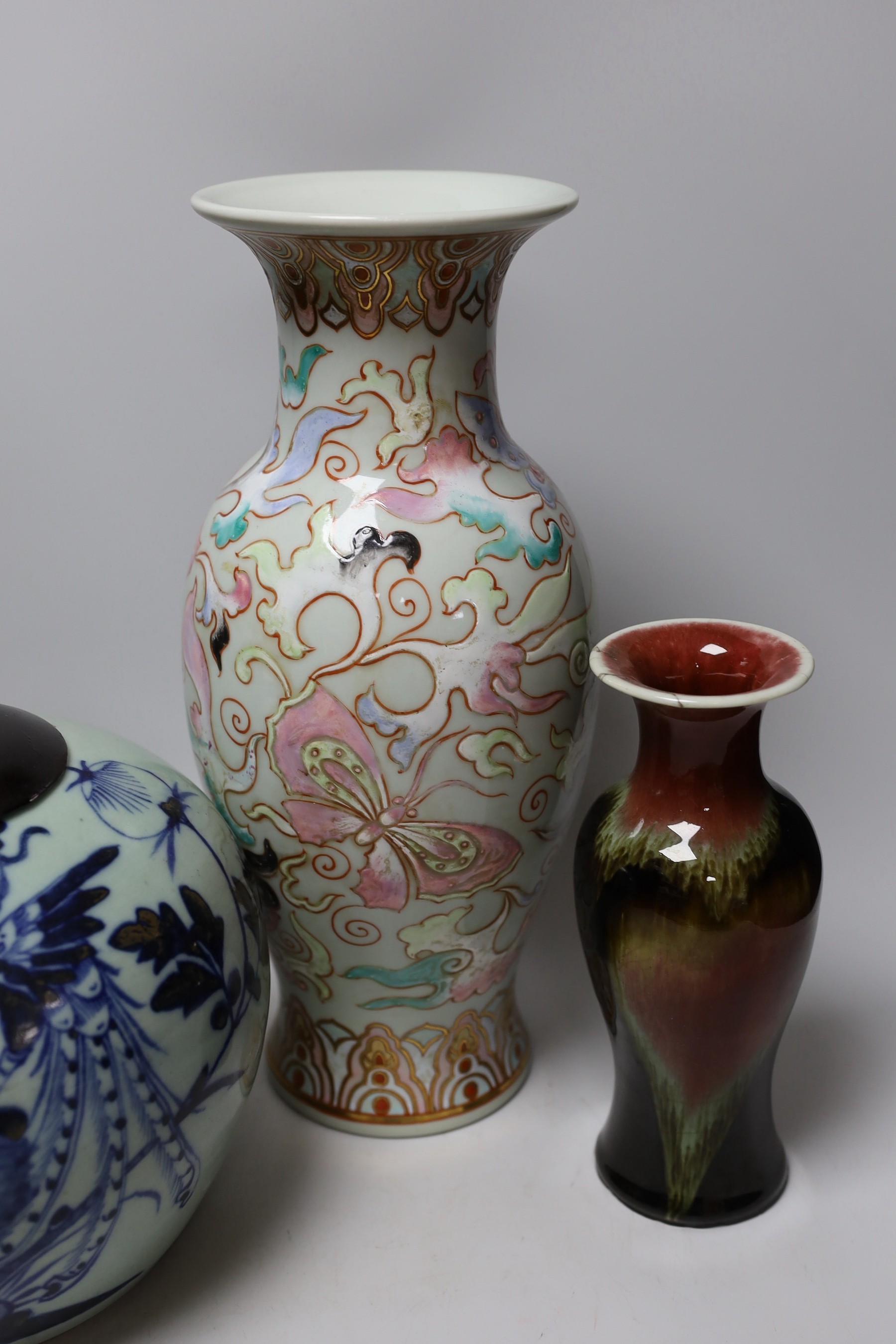 A Chinese blue and white celadon ground jar an enamelled porcelain vase and a flambe vase, tallest 42cms high (3)